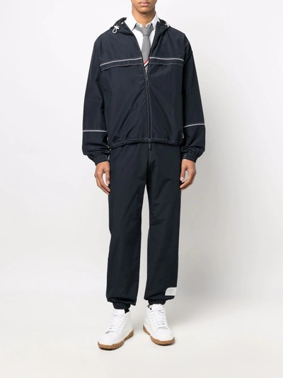 Thom Browne name-tag track pants outlook