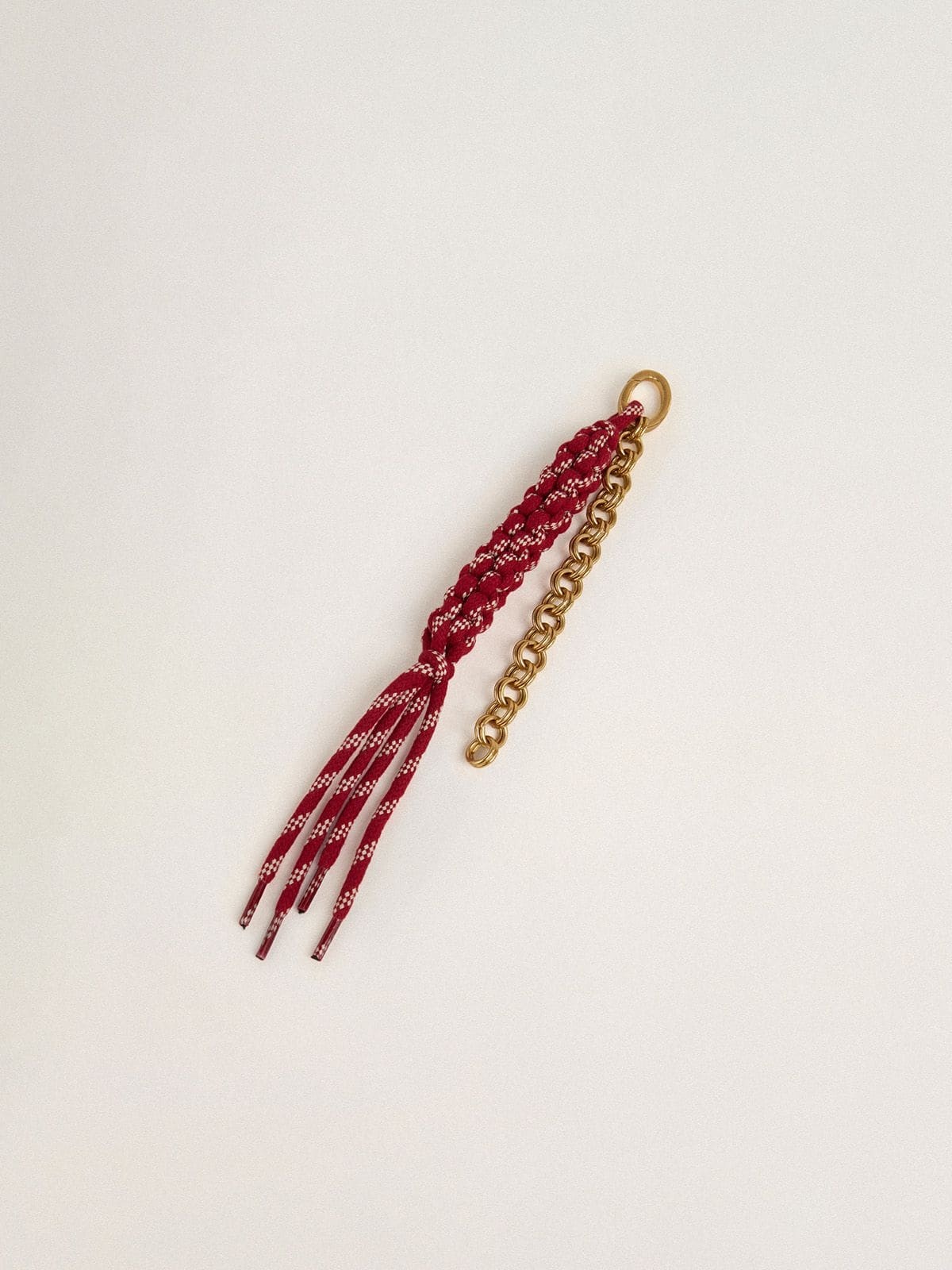 Charm with red knotted laces - 2