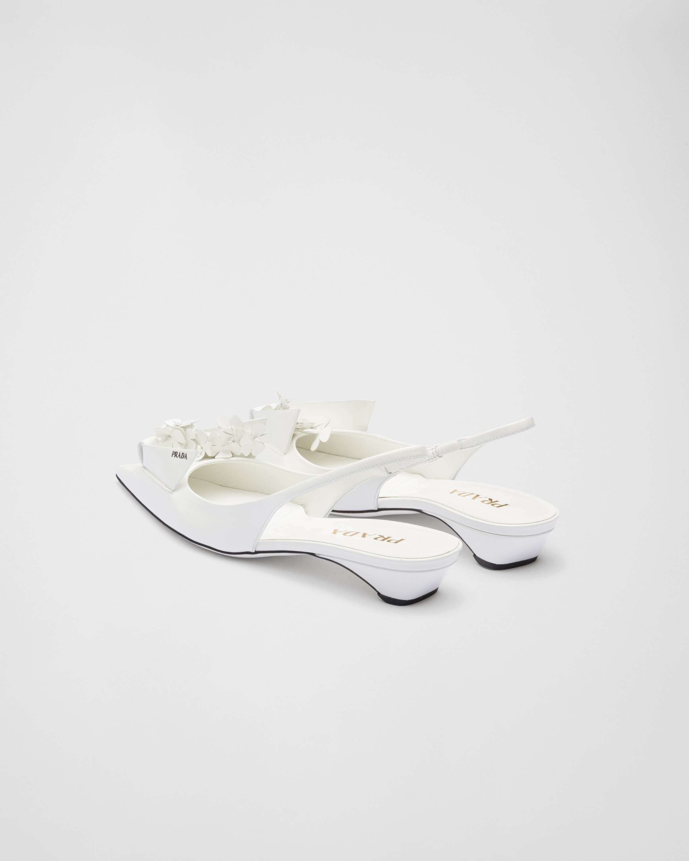 Prada Brushed leather slingback pumps with floral appliques