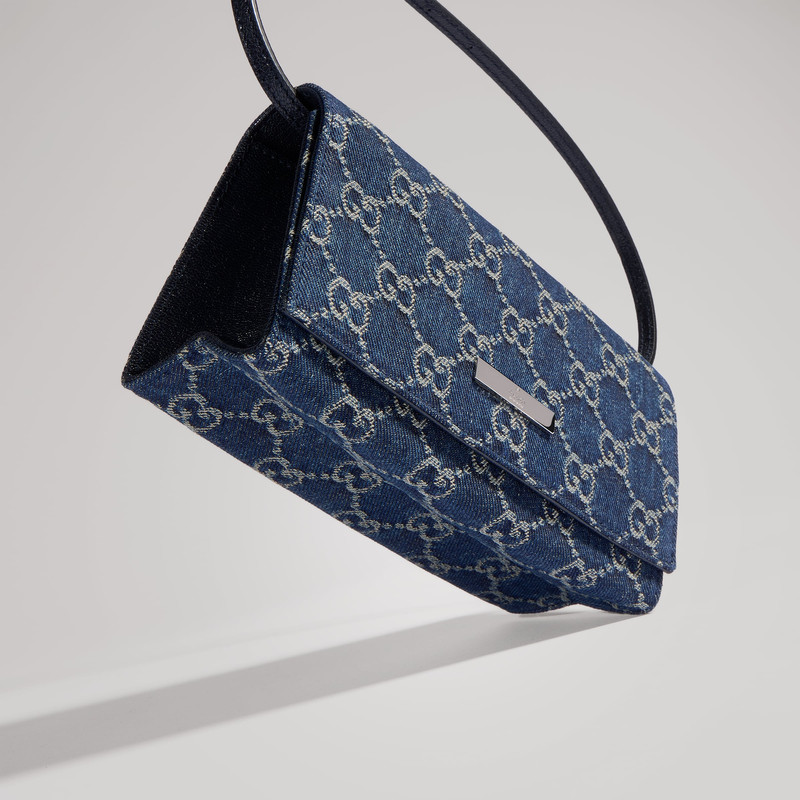 Small pouch with strap and Gucci plaque 9