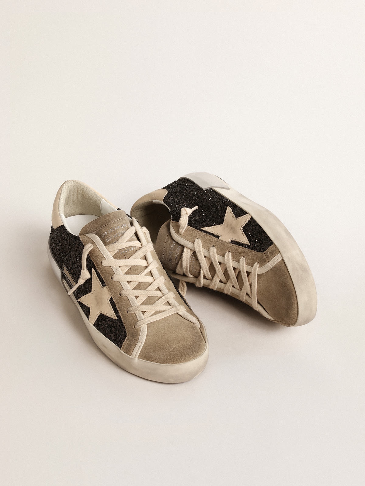 Golden Goose Super-Star in black glitter with cream star and suede inserts  | REVERSIBLE