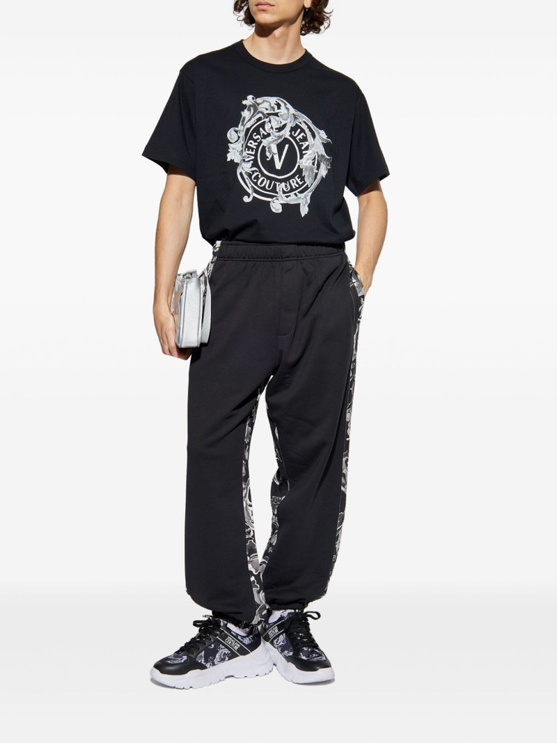VERSACE JEANS COUTURE floral-panelled trousers outlook