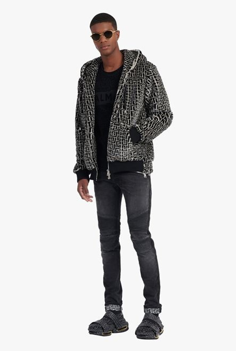 Balmain Slim cut faded and ridged black cotton jeans with Balmain monogram on hem outlook