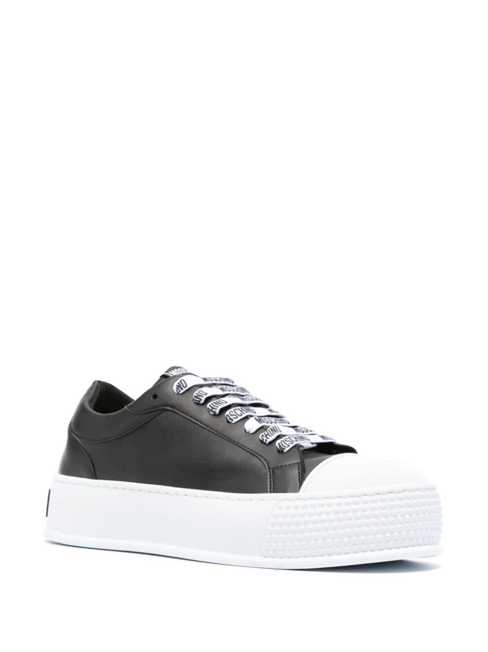 Moschino logo-embossed low-top sneakers | REVERSIBLE