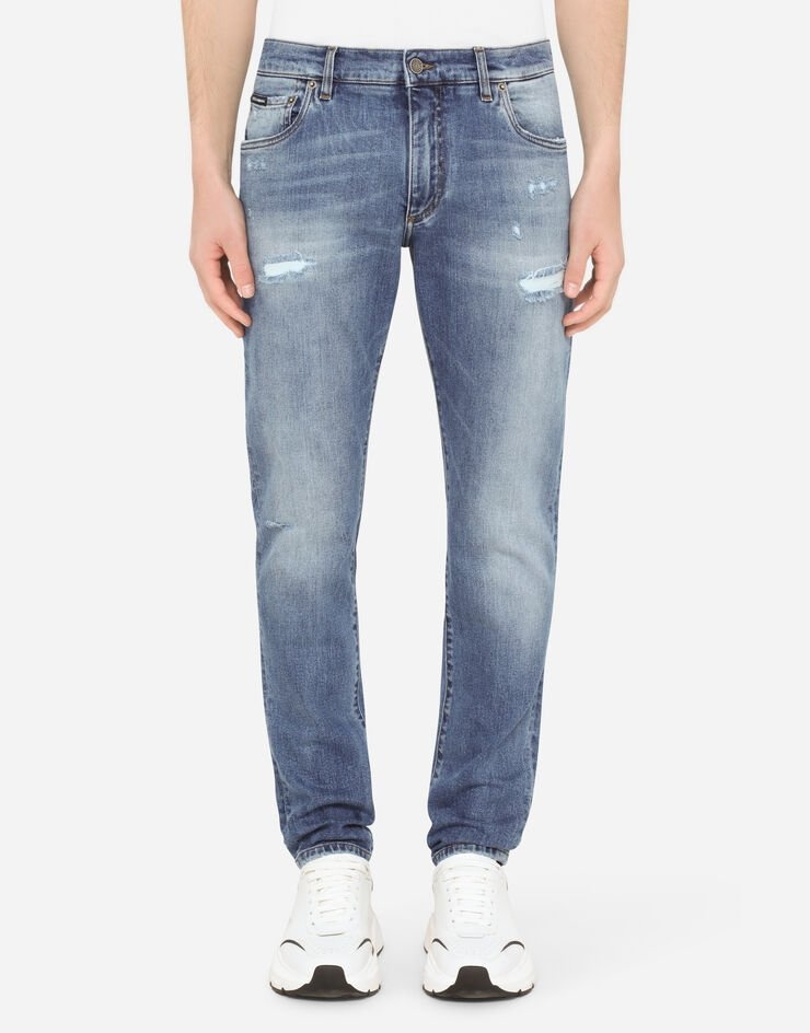 Slim-fit stretch jeans with repaired rips - 1