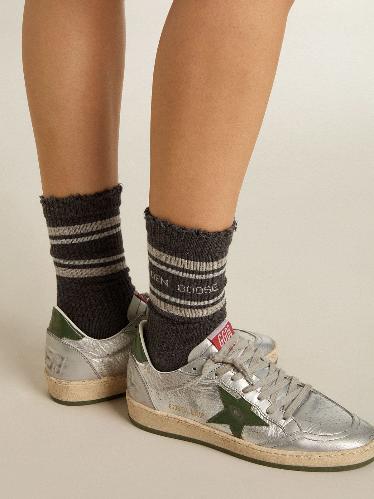 Dark grey socks with distressed details and cream and worn-white stripes - 3
