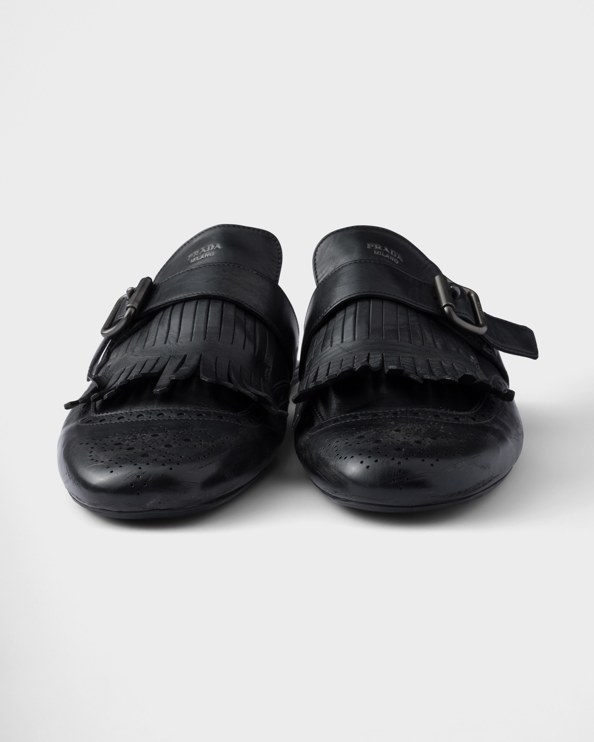 Shuffle antiqued leather mules with buckled strap and fringe - 6