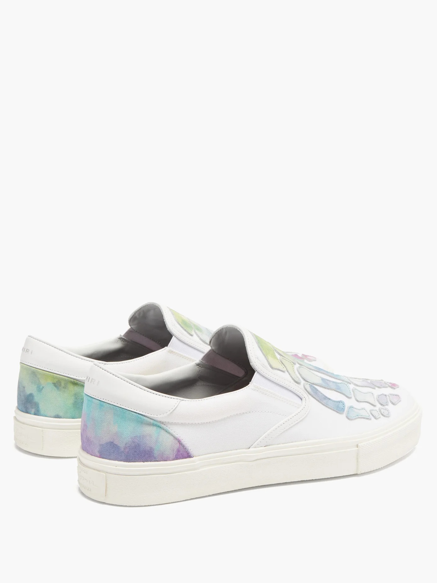 Skeleton leather-appliqué slip-on canvas trainers - 4