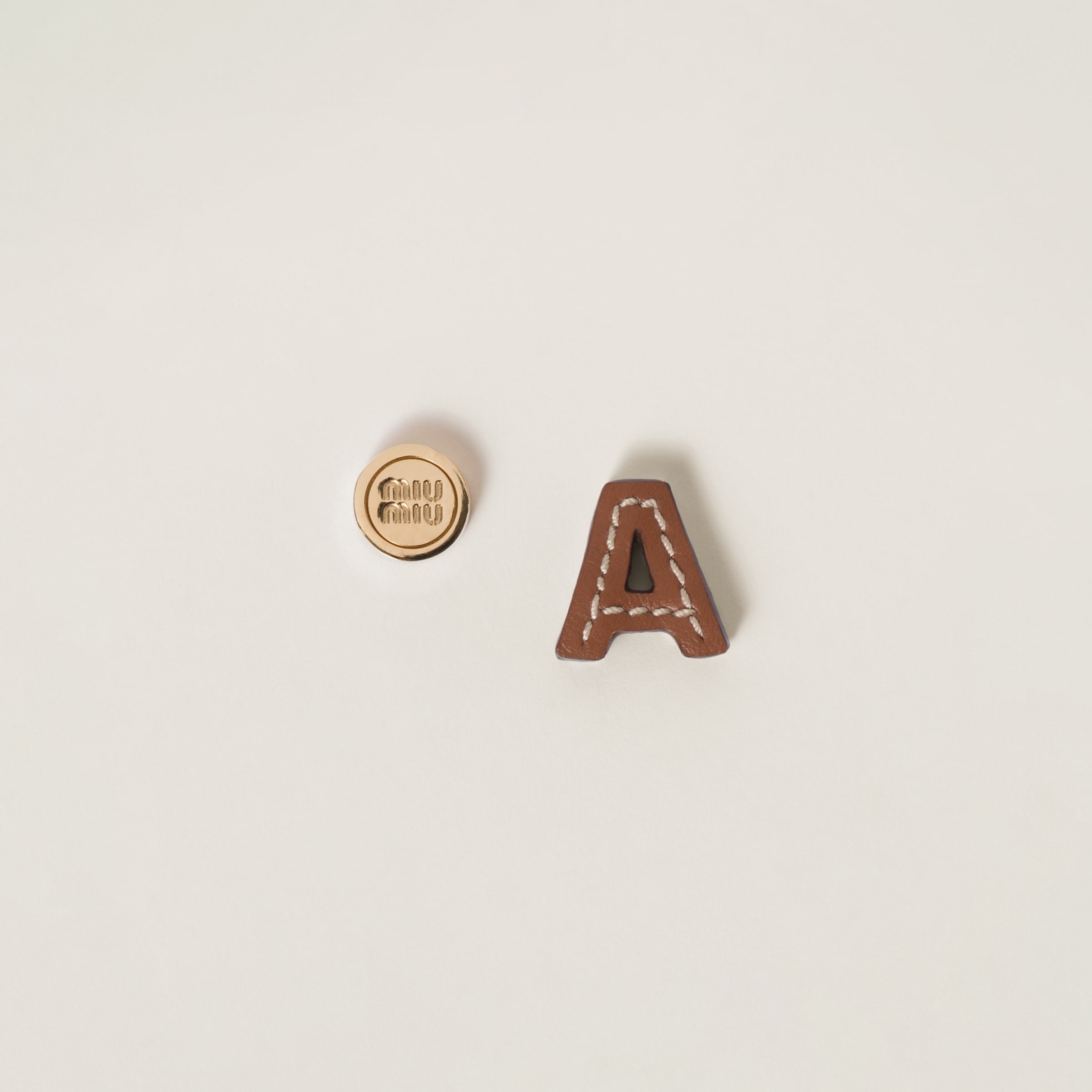 Leather and metal earrings - 1