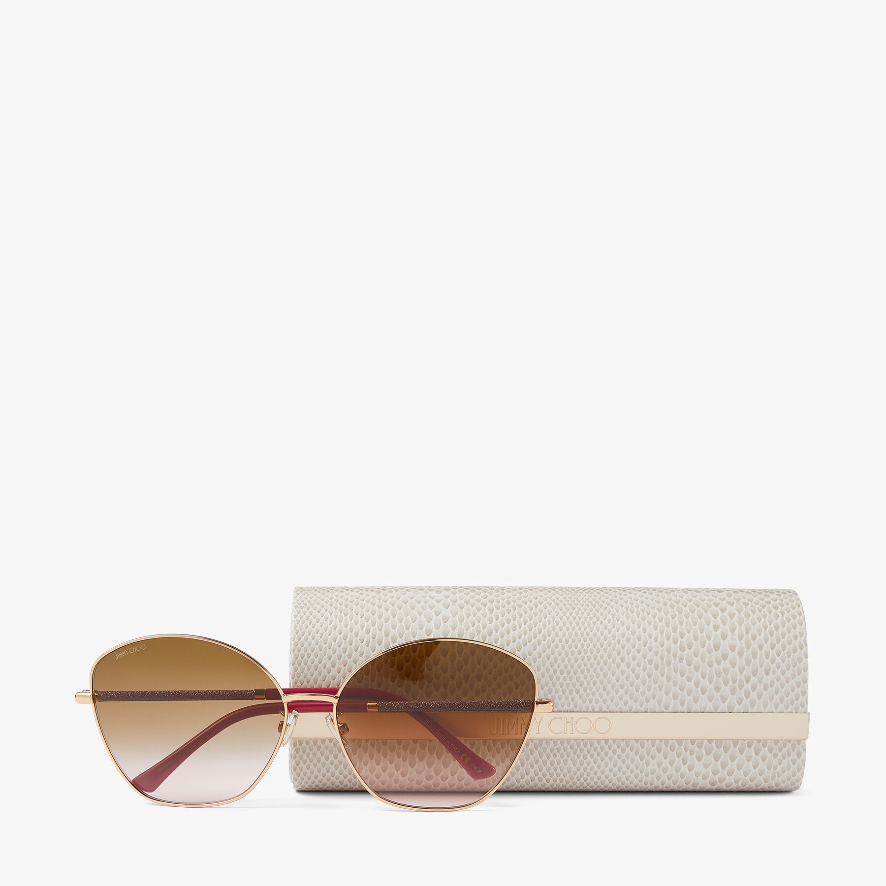 Marilia
Copper Gold Cat-Eye Sunglasses with Brown and Pink Shaded Lenses and Glitter Temples - 4