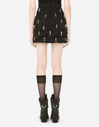 Dolce & Gabbana Quilted nylon miniskirt with pendant embellishment outlook