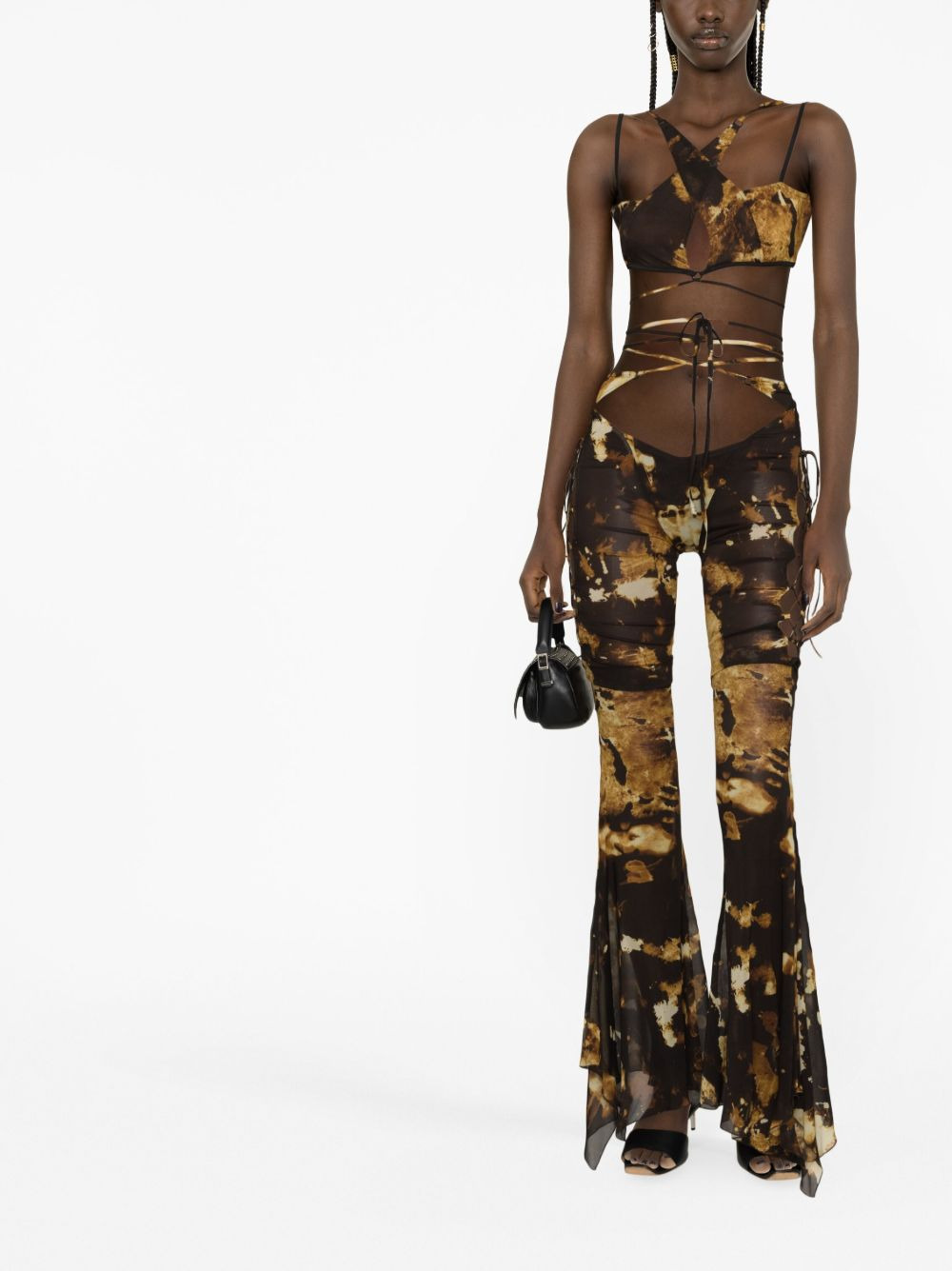 Starlight-print flared trousers - 2