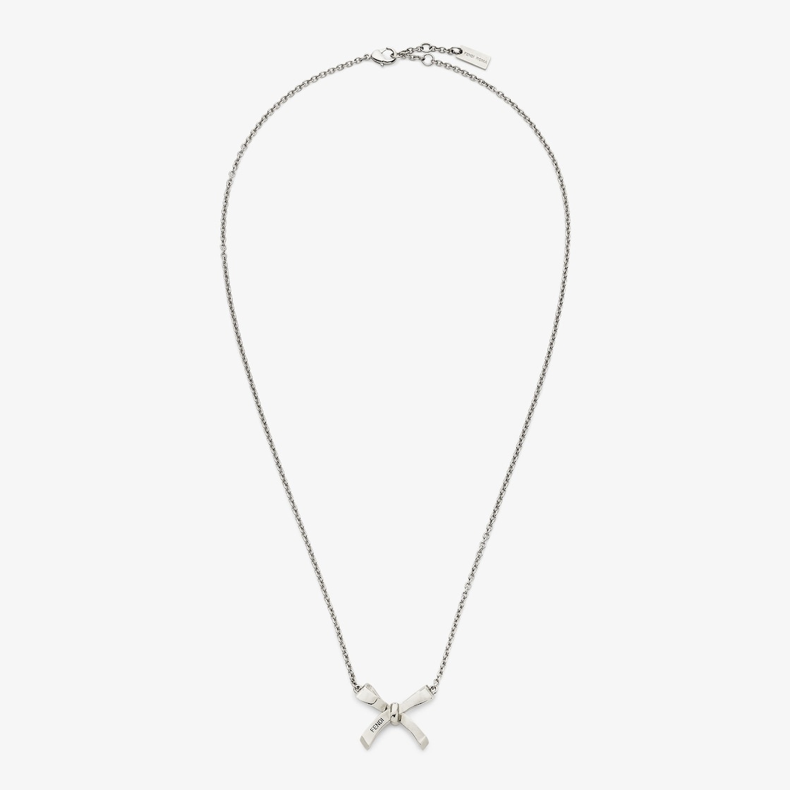 Fine chain necklace with small bow-shaped pendant. Clip closure. Made of metal with a palladium fini - 1