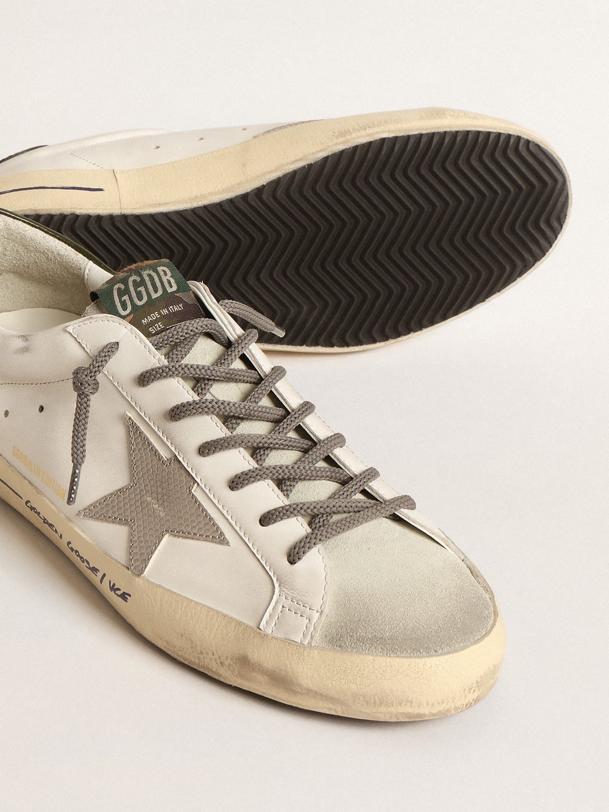 Men's Super-Star with black heel tab and metal stud lettering