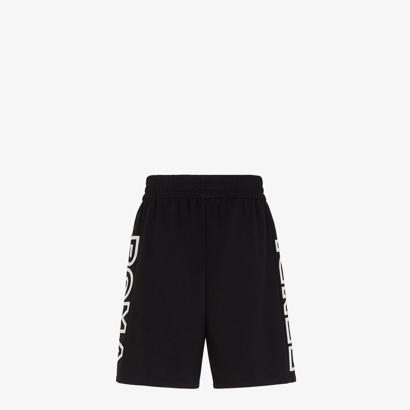 Shorts with an elastic waist and side inset pockets. Made of black jersey. Customized with side stri 2