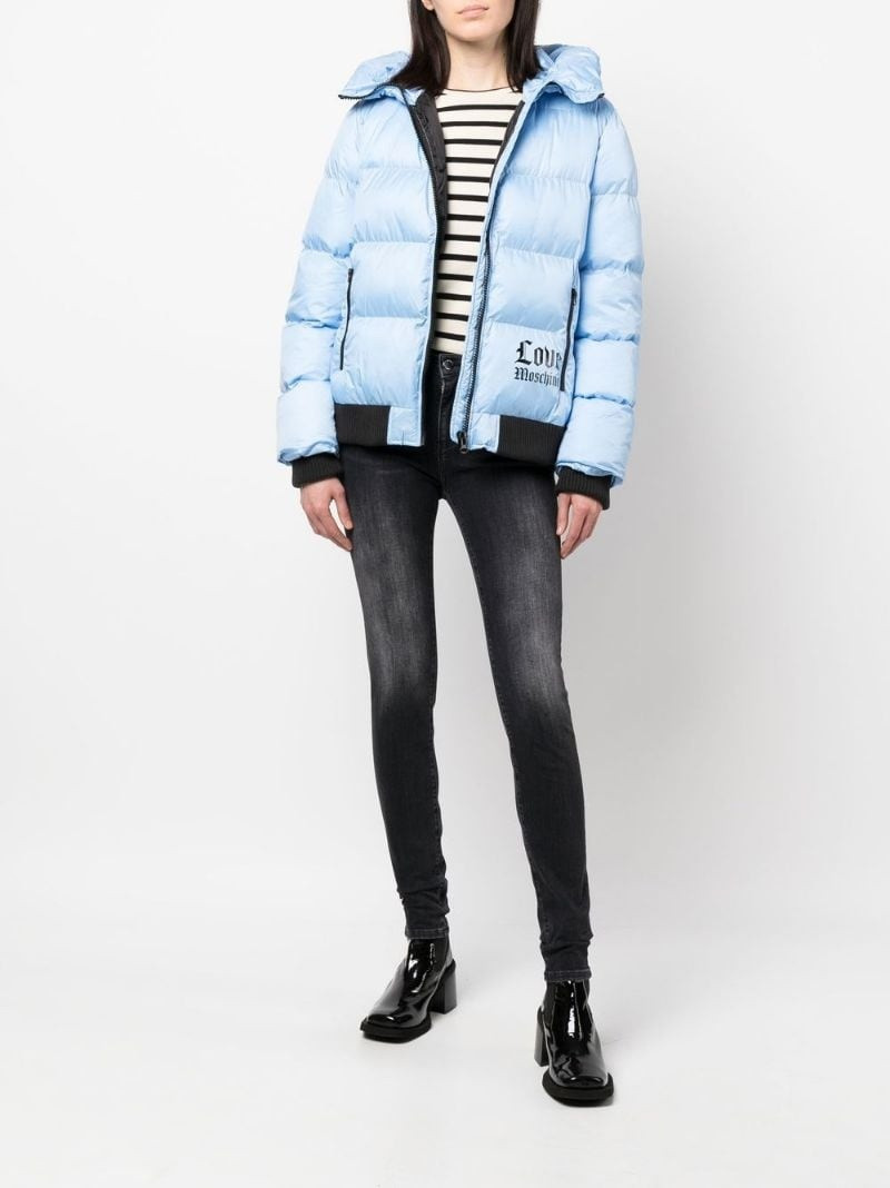 Moschino logo-print skinny-cut jeans outlook