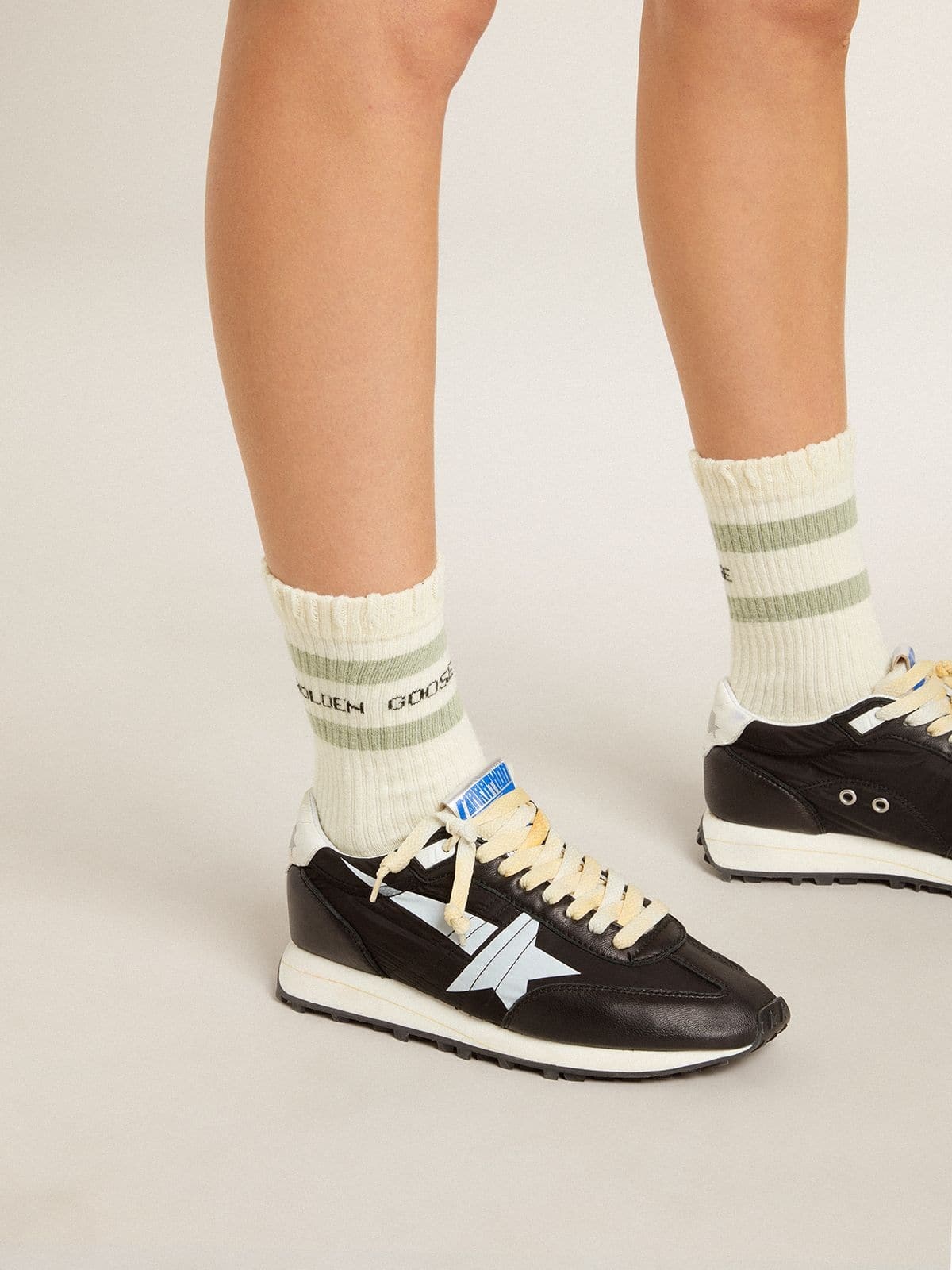 Worn-white socks with distressed details and sage-green stripes - 4
