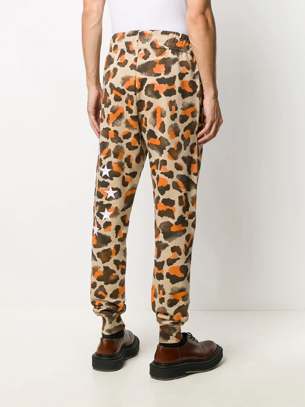 all-over leopard print trousers - 4