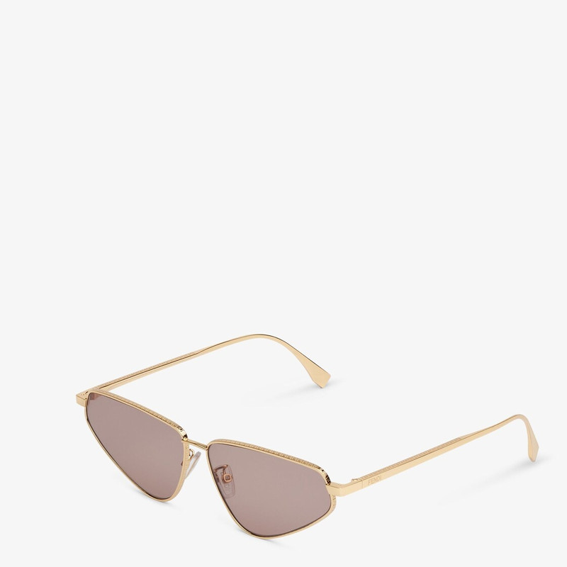 FENDI Cat-eye FF sunglasses in gold-colored metal with FF motif engraved on the front and temples. Brown l outlook