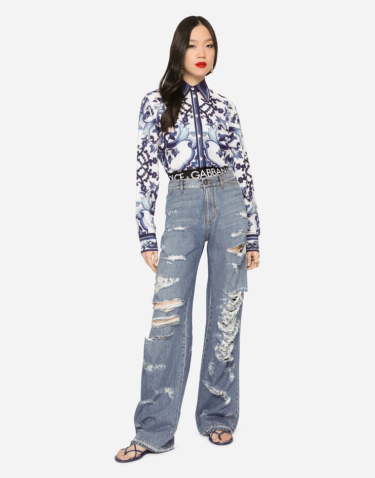 Flared jeans with ripped details - 1