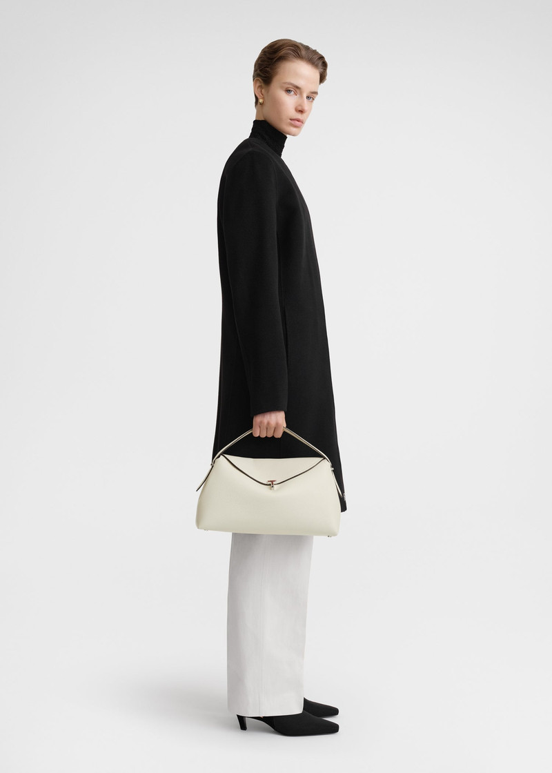 Totême T-Lock top handle milk grain outlook