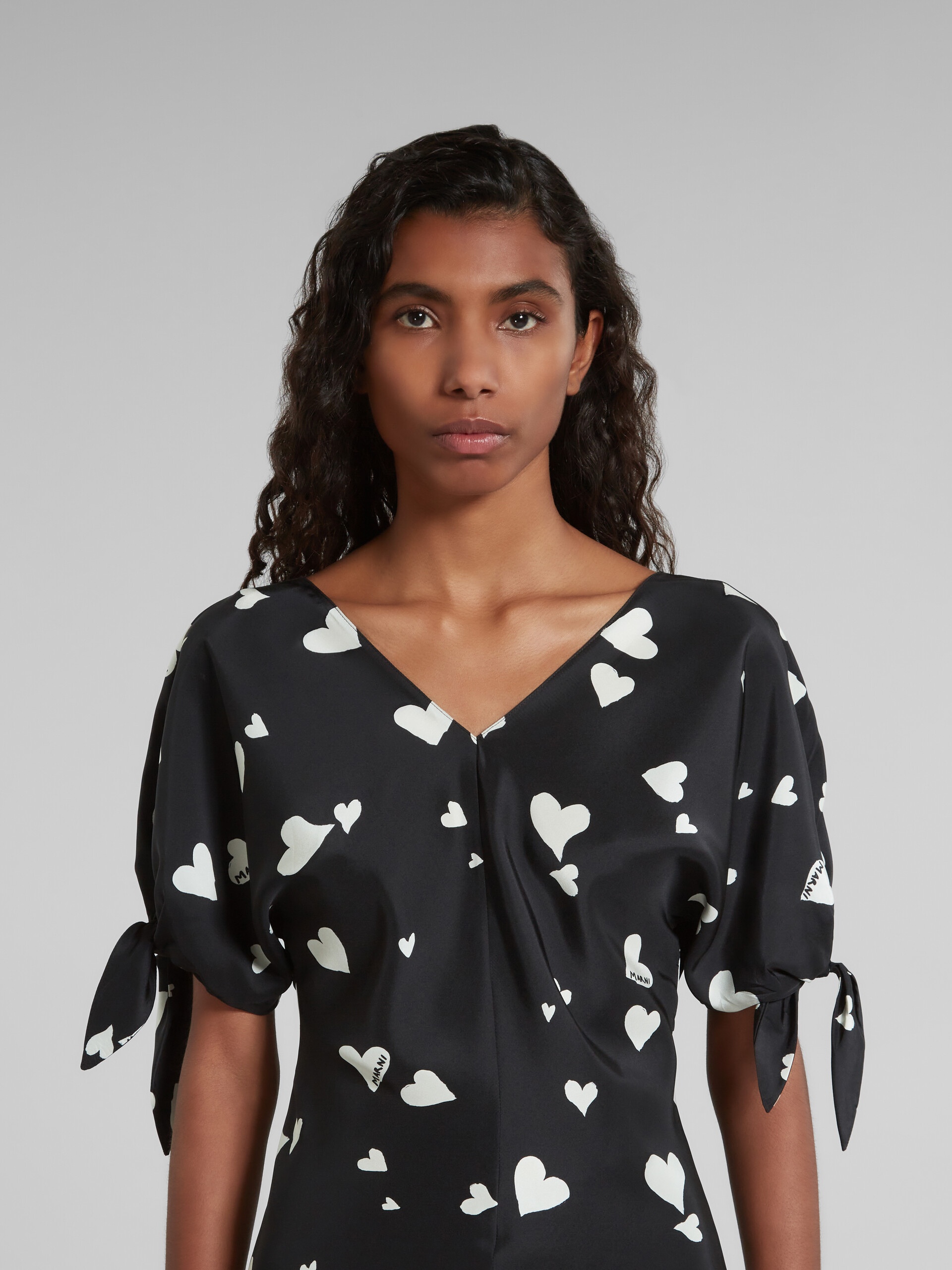 BLACK SILK BOW-SLEEVE TOP WITH BUNCH OF HEARTS PRINT - 4