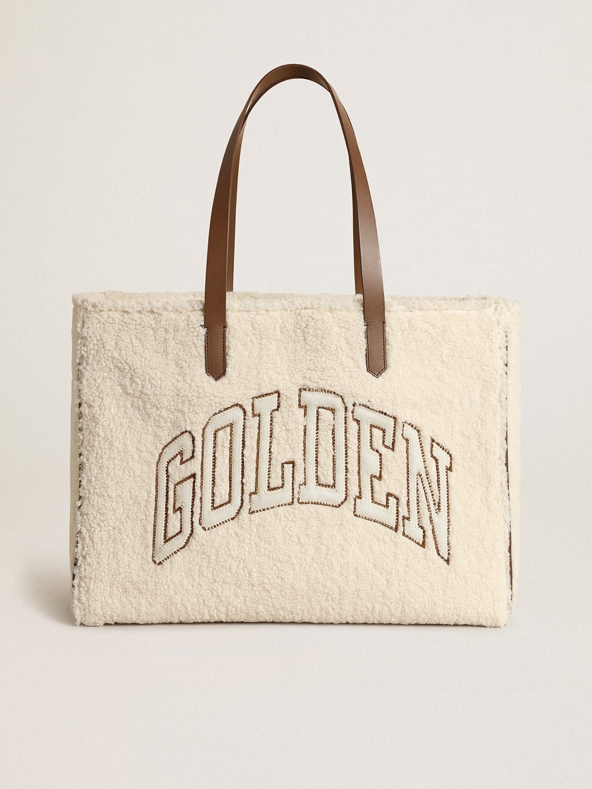 East-West California Bag in white faux fur with Golden lettering and contrasting handles - 1