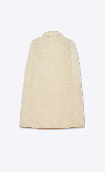 SAINT LAURENT buttoned cape in shearling outlook