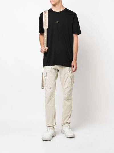 C.P. Company logo-patch tapered cargo trousers outlook