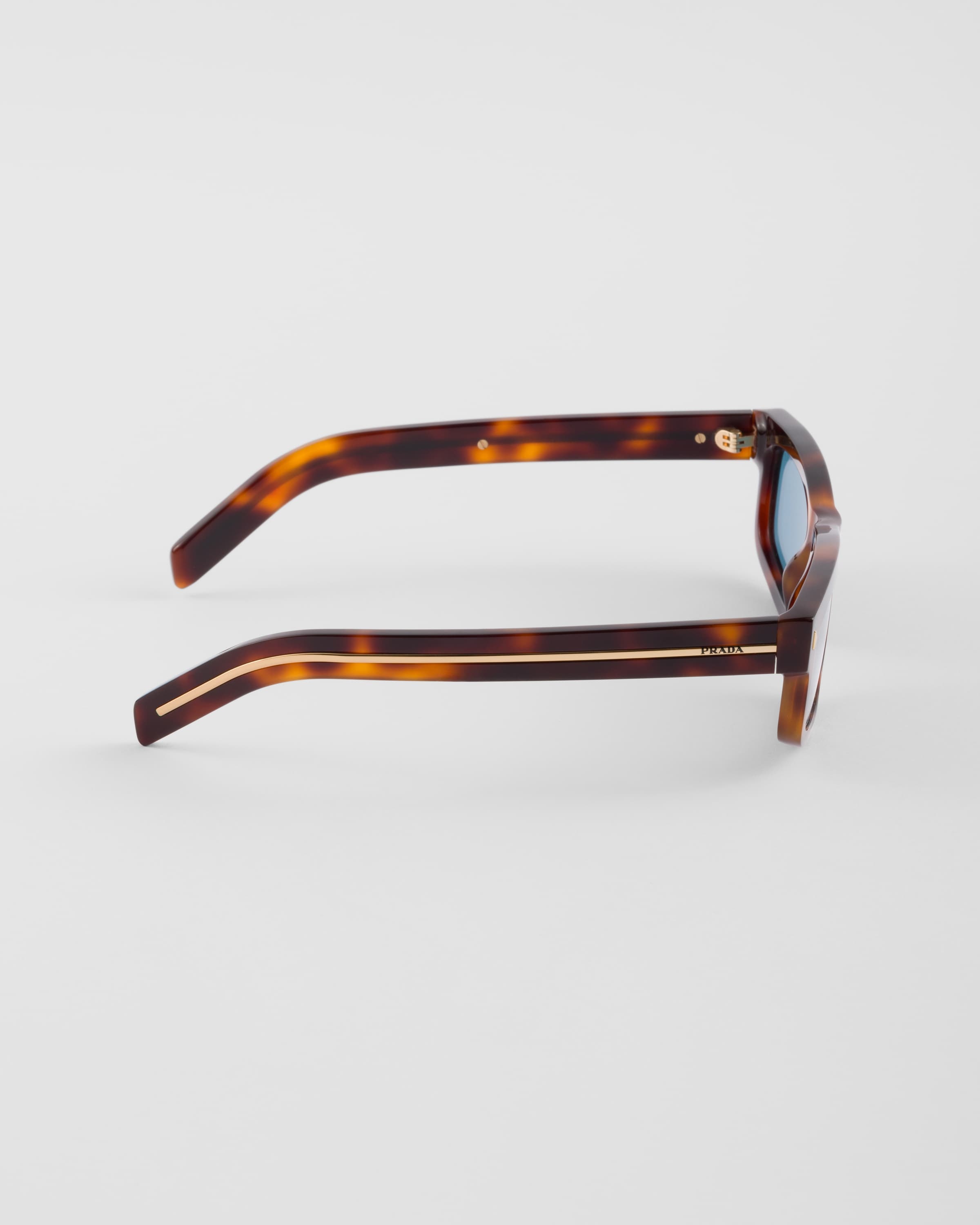 【日本入手困難】Sunglasses with the iconic l plaque Prada Sunglasses with the iconic metal plaque | REVERSIBLE