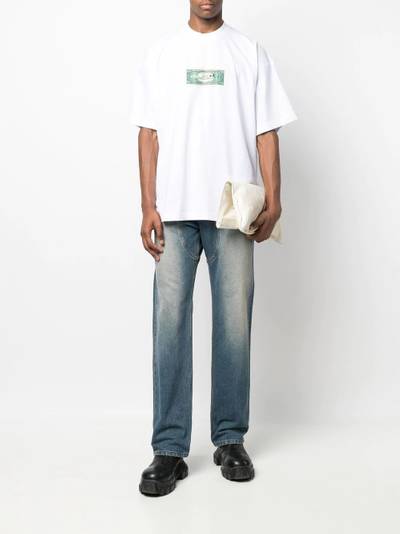 VETEMENTS dollar-print oversized T-shirt outlook