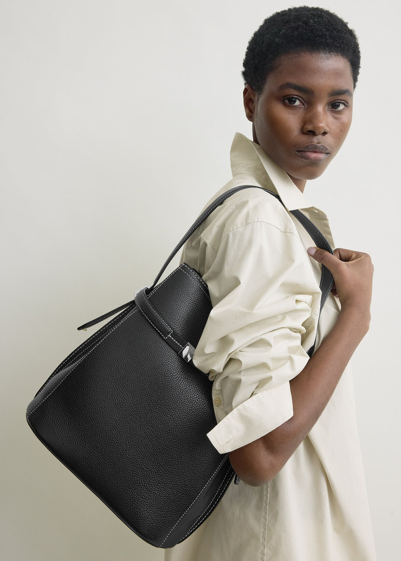 TOTEME Belted grained-leather bucket bag black outlook