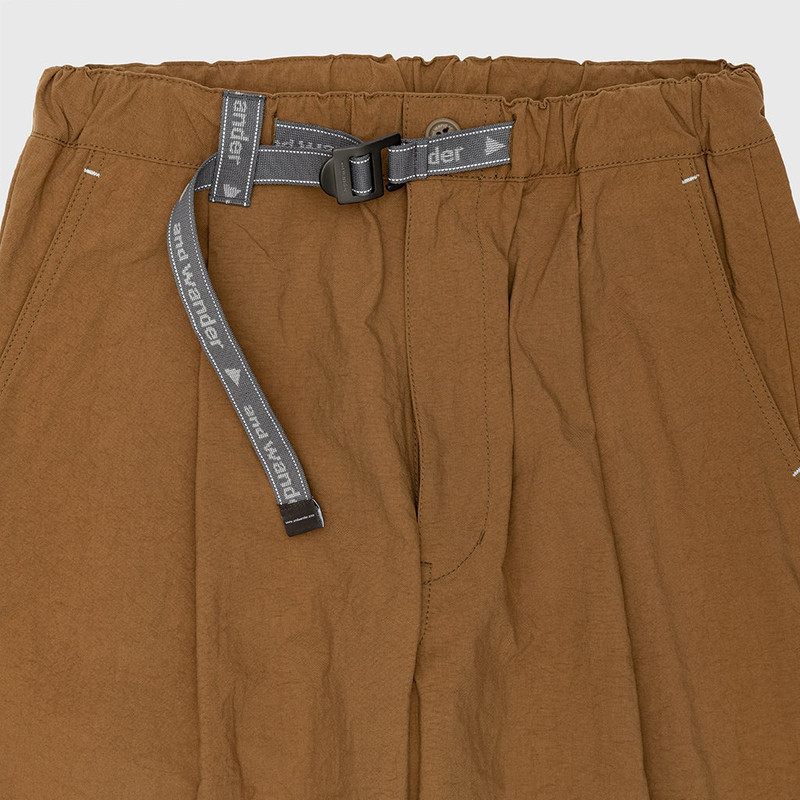 and Wander NYLON CHINO TUCK TAPERED PANTS outlook