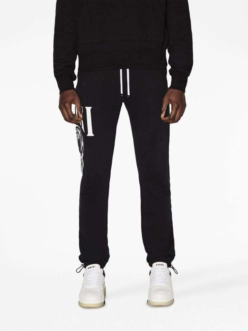 AMIRI graphic-print cotton track pants outlook