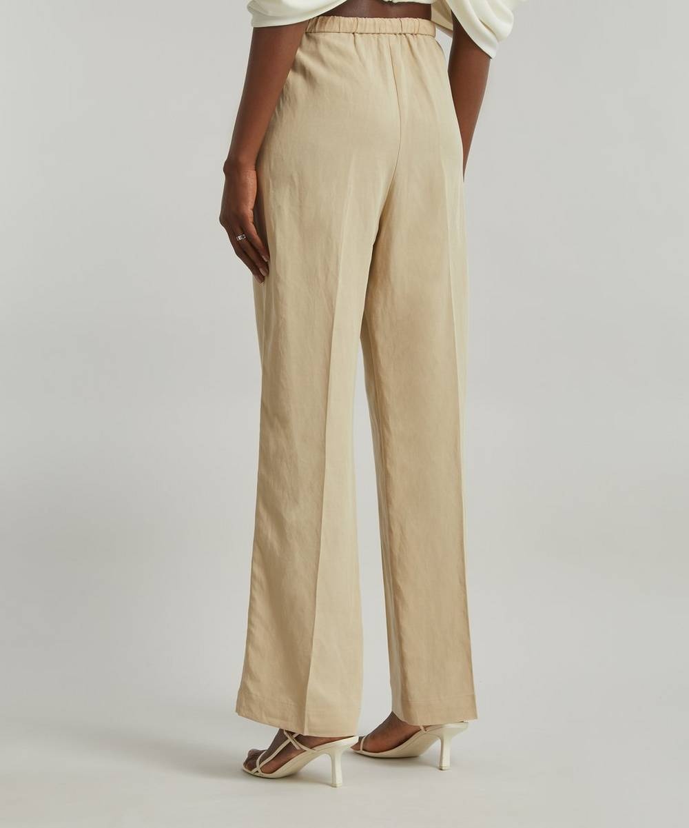 Totême Press-Creased Drawstring Trousers | REVERSIBLE