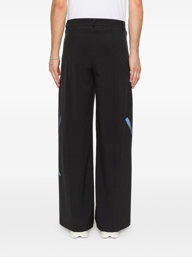 x entire studios Z.N.E. logo-print wide-leg trousers 4