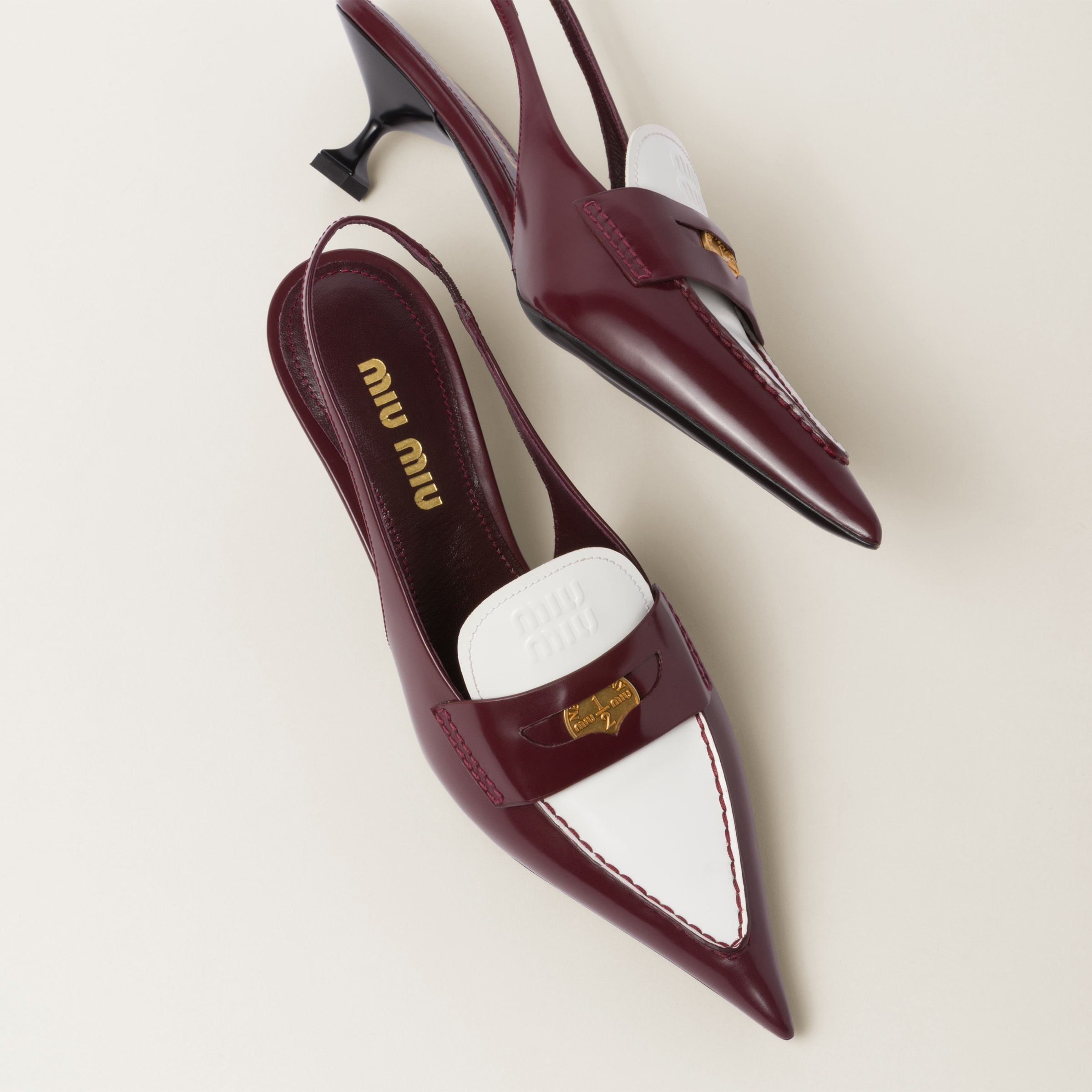 Miu Miu Leather penny loafers with heel | REVERSIBLE