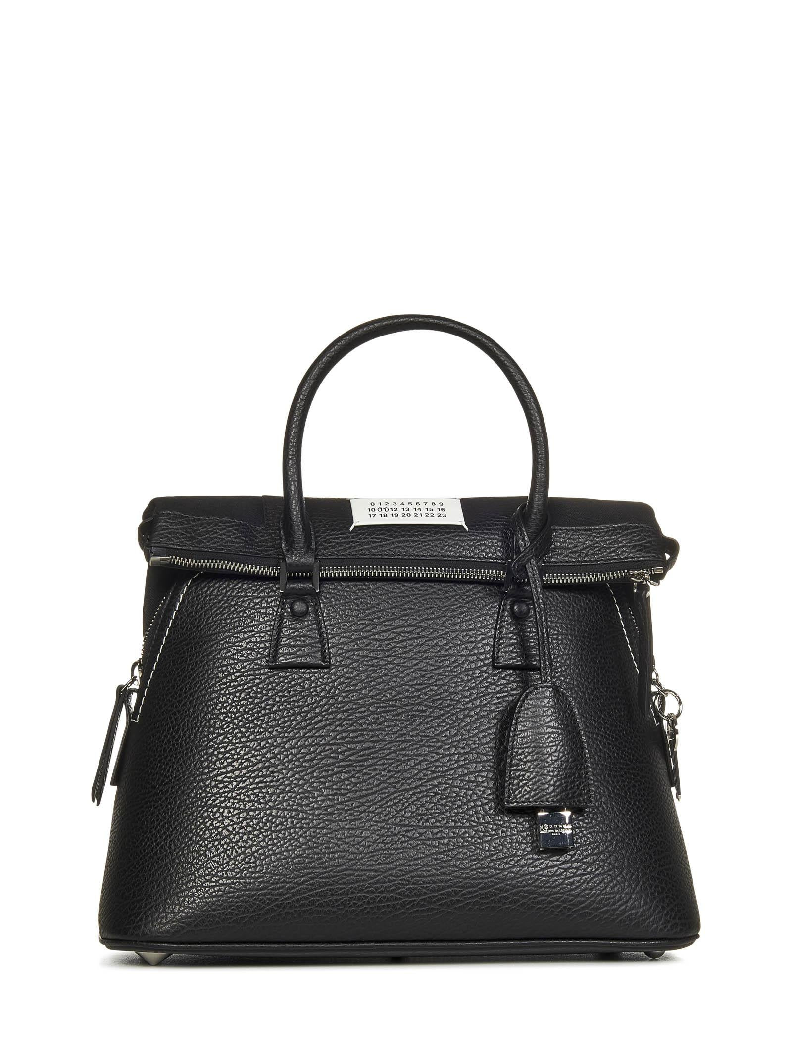 Black textured leather shoulder bag with logo label and leather shoulder strap. - 1