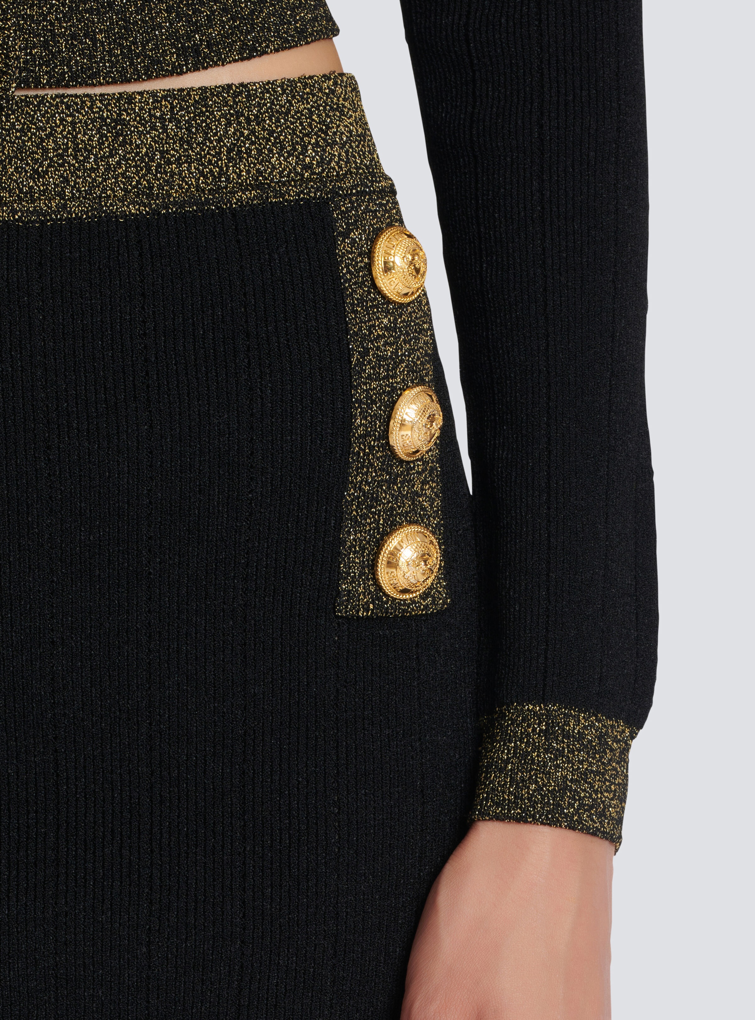 Short knit skirt with gold trim - 6