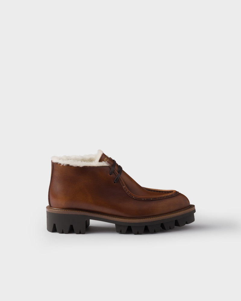 Prada Leather and shearling booties outlook
