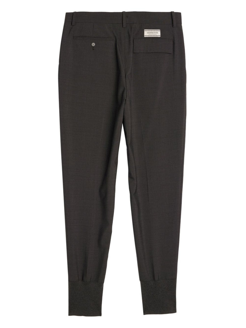 UNDERCOVER logo-appliquÃ© tapered cotton trousers outlook