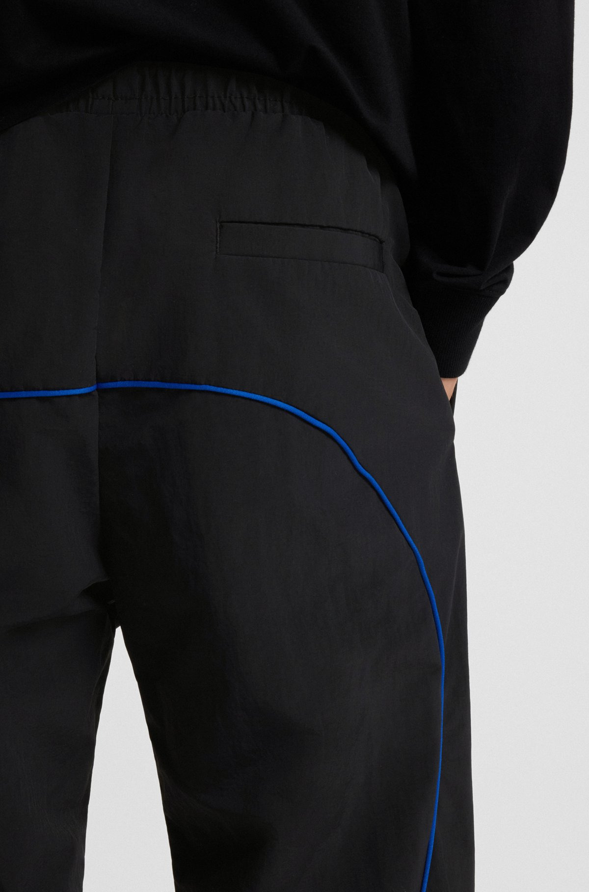 WATER-REPELLENT TROUSERS WITH LOGO AND PIPING - 5