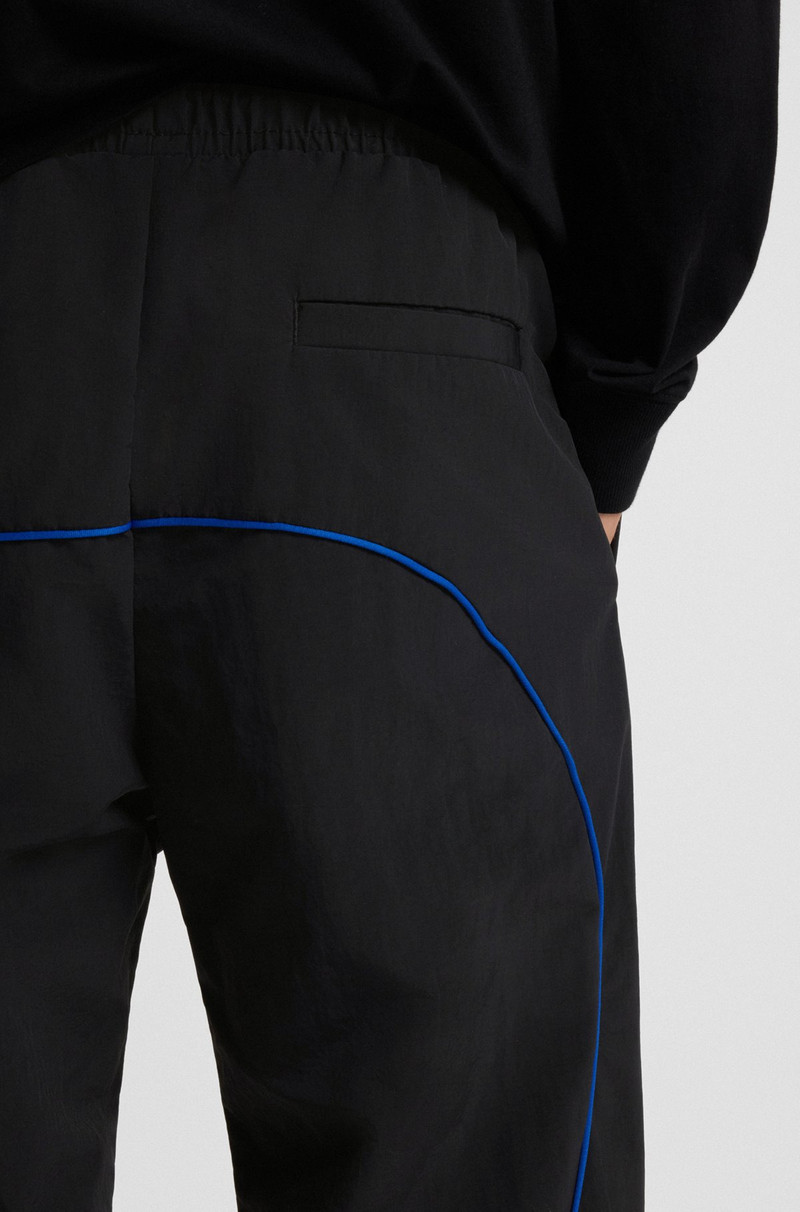 WATER-REPELLENT TROUSERS WITH LOGO AND PIPING 5