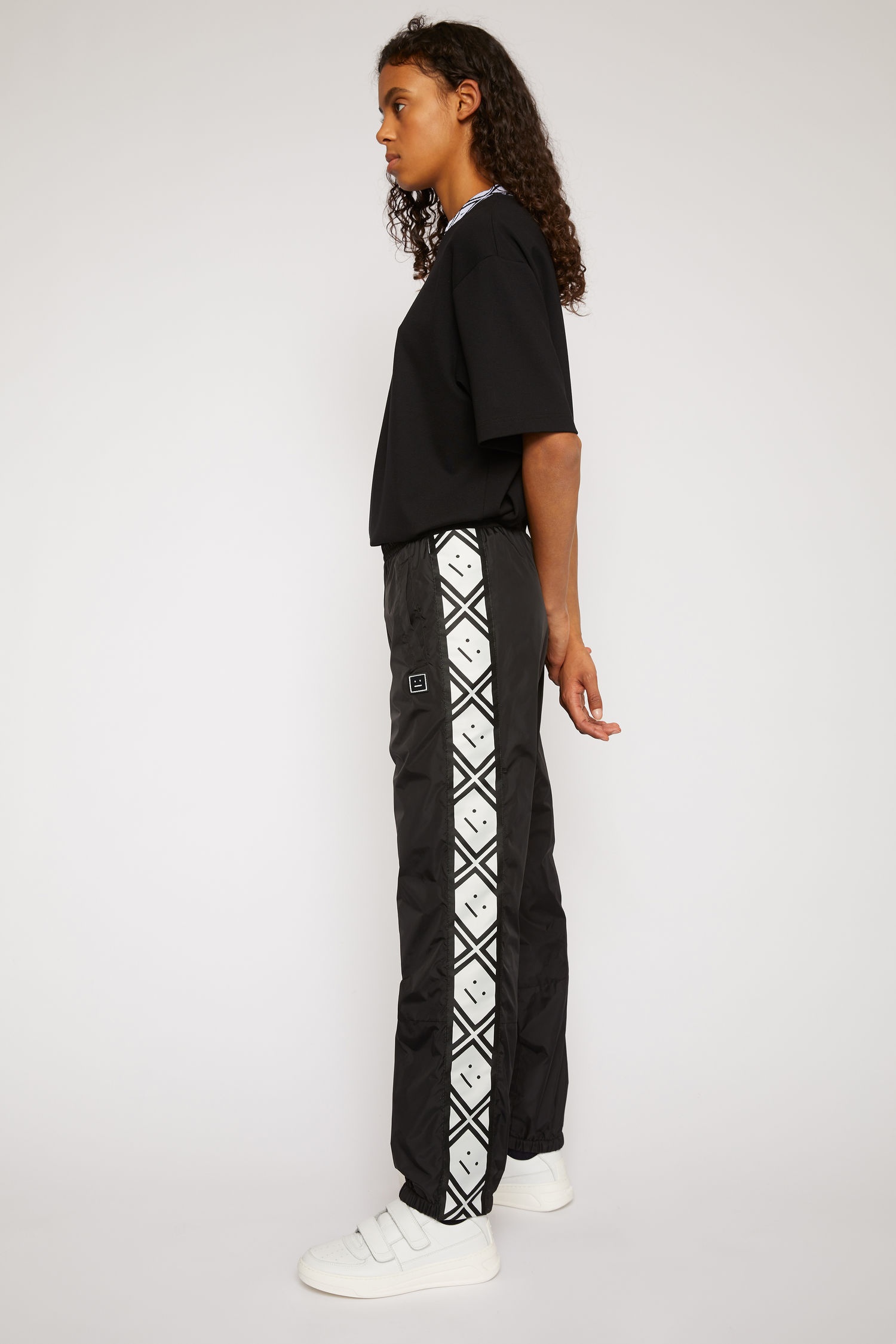 Face motif stripe track pants black - 3