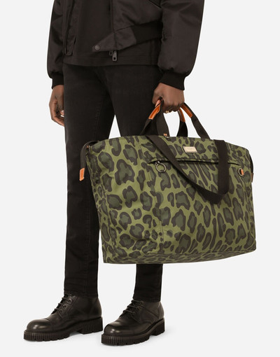 Dolce & Gabbana Nylon travel bag with leopard print against a green background and branded plate outlook