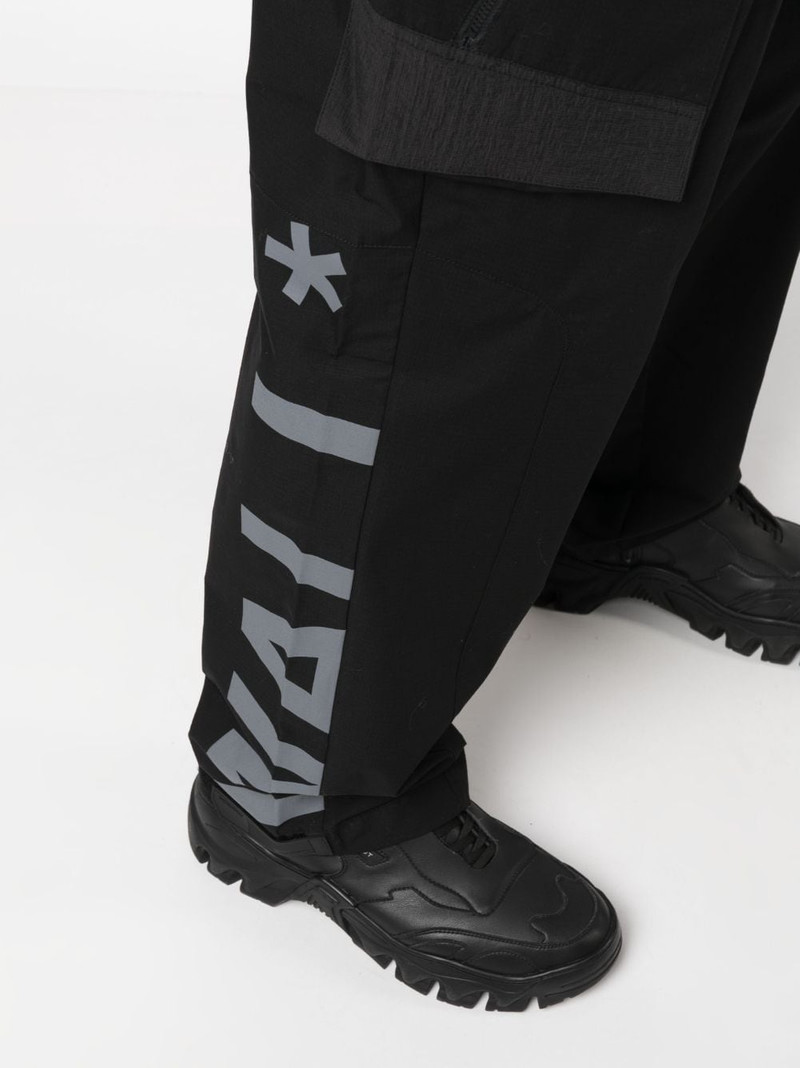 Overset Tech logo-print trousers 5