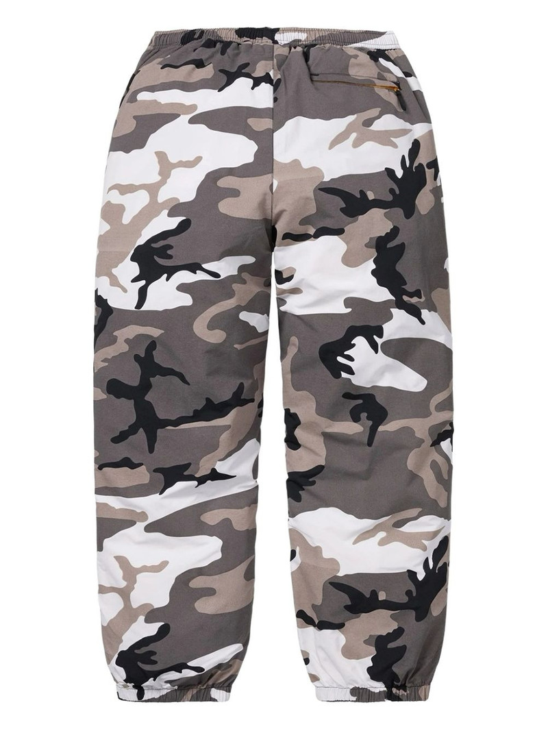 Supreme camo-print zip-detail trousers outlook