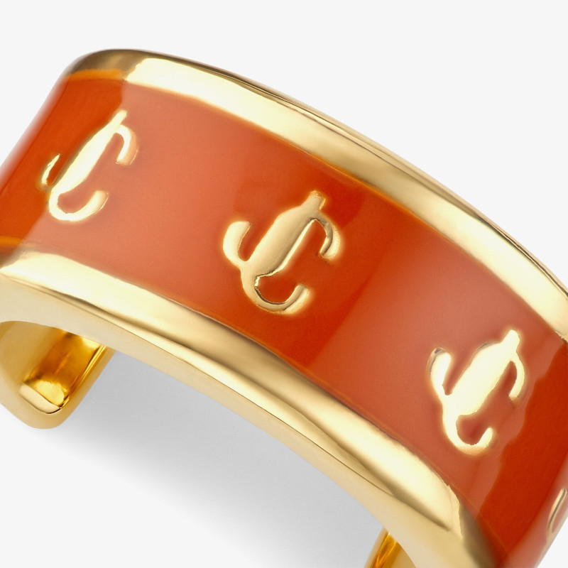 Single JC Ear Cuff
Gold-Finish Metal and Amber Orange Enamel JC Ear Cuff 5