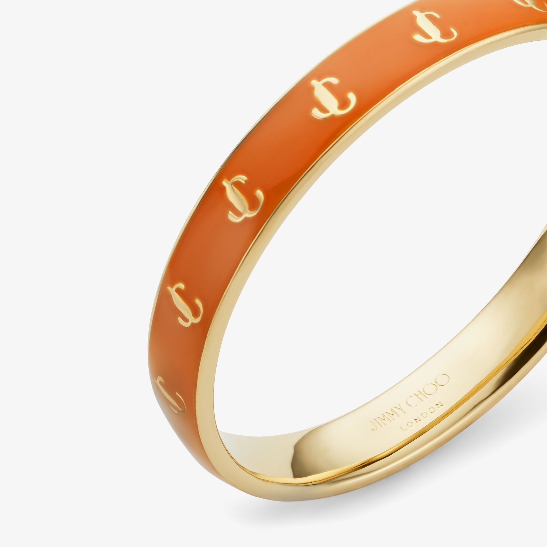 JC Enamel Bangle
Gold-Finish Metal and Amber Orange Enamel JC Bangle - 5