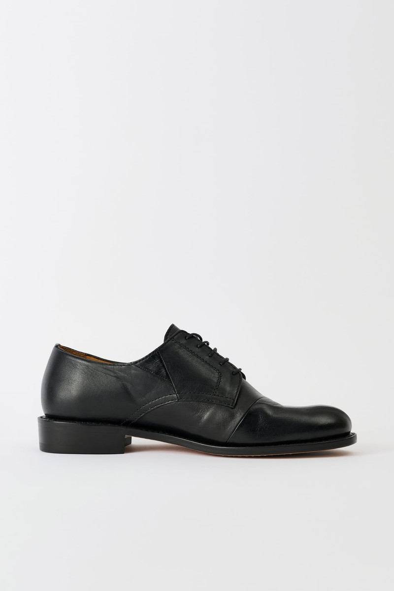 Patched Parade Malleable Black Bull Hide 4